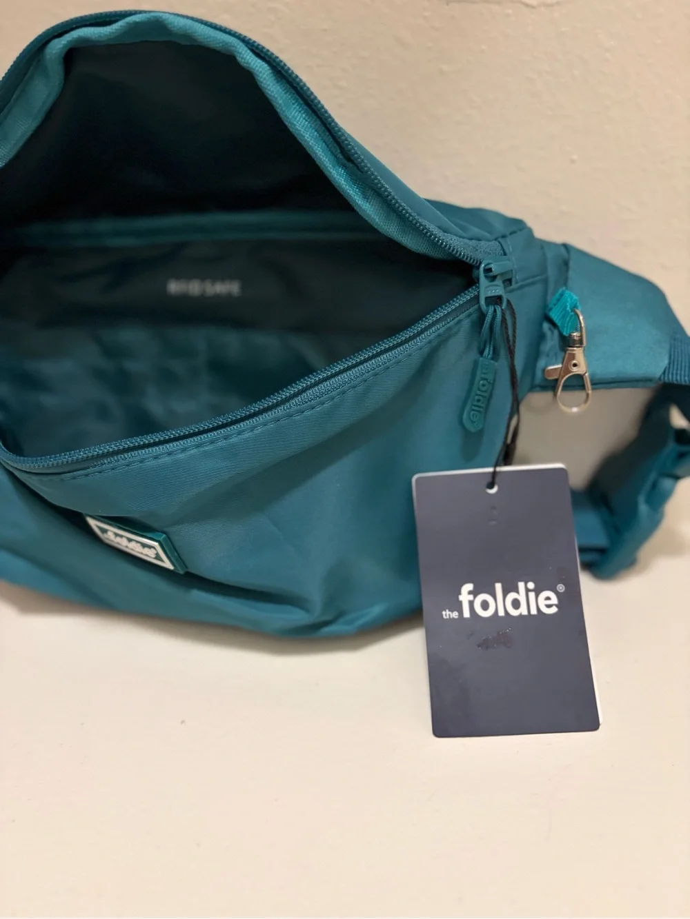 The Foldie Teal Waist Crossbody Bag RFID Blocking Travel Hand Free NWT